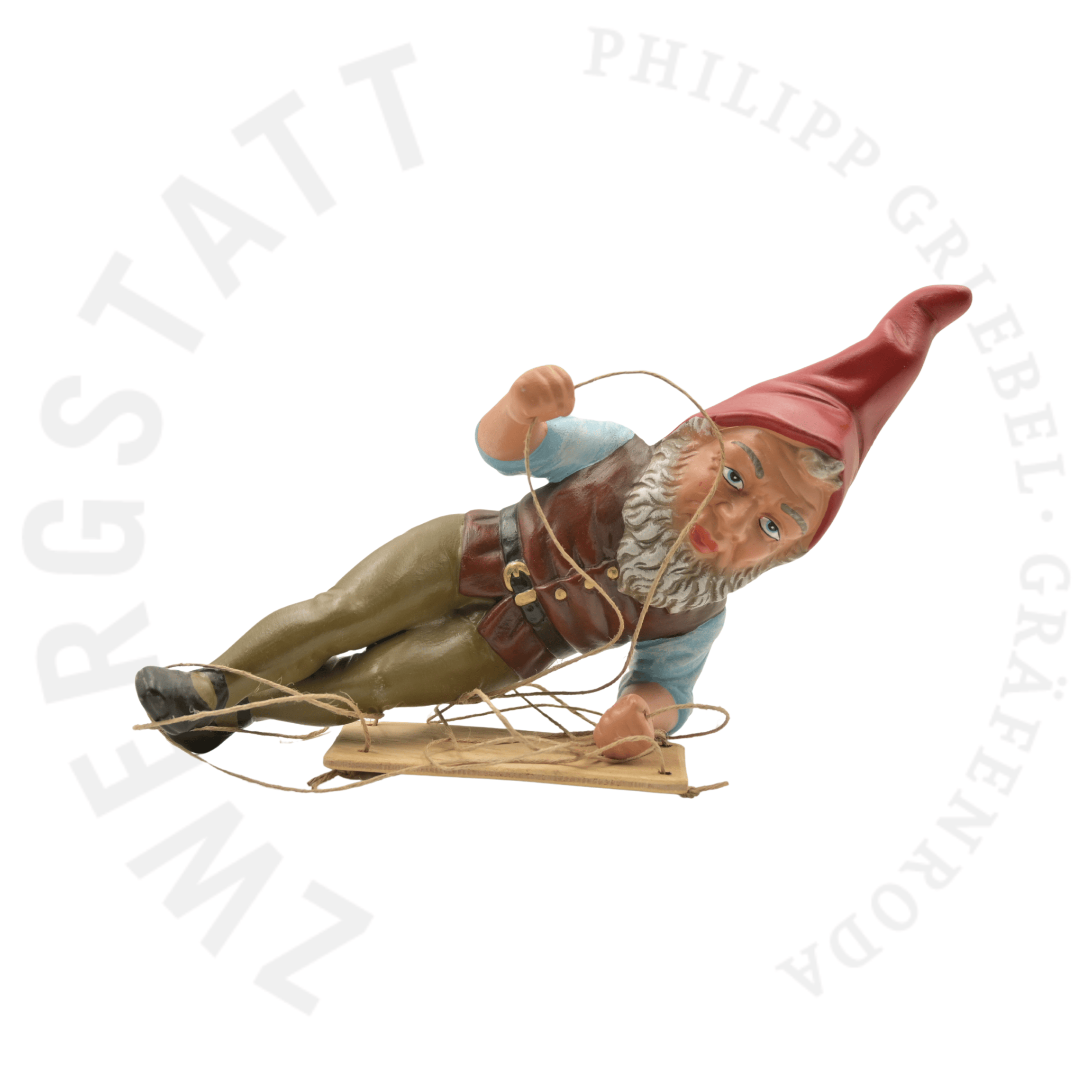 Nain de jardin Adalbert le Balancier allongé sur le côté, vue de face, figurine artisanale