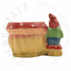 Fly agaric planter garden gnome with saxophone – back view